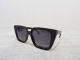 black sunglasses on a white table with a white background