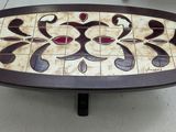a coffee table with a mosaic design on it
