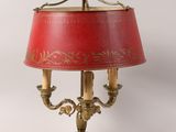 an image of a lamp with a red shade on a table