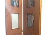 a wooden door with pictures on the inside of it