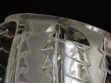 a close up of a glass object on a black surface