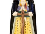 figurine de Sainte Anne des Brenos Pom tenant une croix