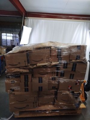 a large stack of boxes on a pallet in a warehouse