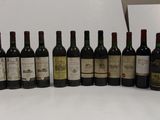 many bottles of wine lined up on the counter