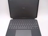 a laptop with a keyboard on it sitting on a table