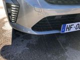 a close up of a car ' s front grill with a license plate on it