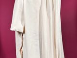 an image of a mannequin wearing a white shirt and brown pants