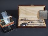 a box with silverware in it on a table