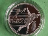 a close up of a coin with a baseball player on it
