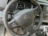 dashboard of a car with a steering wheel and dashboard controls