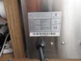 an image of a stainless steel device with a barcode on it