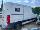 a white van that is parked in the dirt