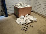 a wooden box filled with bags of bags and some screws