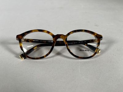 the glasses are made of tortoises and have a gold rim