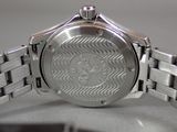 a close up of a watch on a table