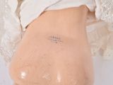 a close up of a woman ' s butt with a tattoo on it