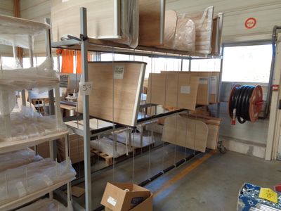 a room with a lot of boxes and boxes on the shelves
