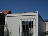 an image of a white container with bars on it
