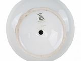 a white plate with a black and white design on it