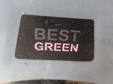 a sign that says best green on the side of a car