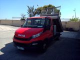 a red truck that is parked in a parking lot