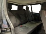 a seat in the back of a vehicle with a red button