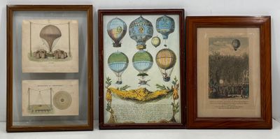 three framed pictures of hot air balloons are on display in a room