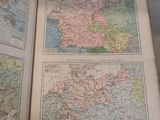 an open book with maps of europe and asia on it