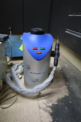 a vacuum that is sitting on the floor in the room