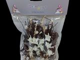 a bag of dried flowers in it on a black background