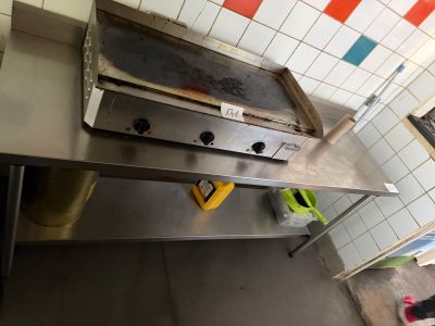 an image of a kitchen with a stove and a counter