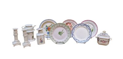 many different types of plates and bowls on the table
