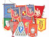 many different colored flags hanging on a wall