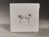 a white box with two earphones in it on a table