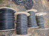 many different types of hoses on the ground next to each other