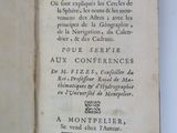 an old book with writing on it sitting on a table