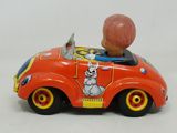 a small toy car with a little boy in it