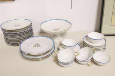 a lot of plates and bowls on the table
