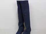 a pair of blue knee high boots sitting on top of a white floor