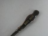 a silver spoon with a number on it on a table