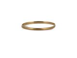 a gold ring with a thin band on a white background