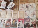 many cards and postcards on the table together