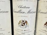 three bottles of wine sitting on top of a table next to each other