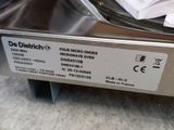 a close up of a machine with papers on it