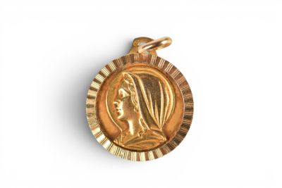 a close up of a gold medal on a white background