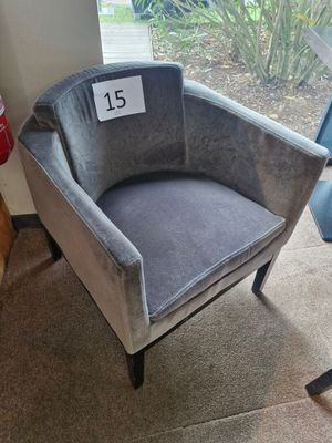 a chair that has a price tag on the back of it