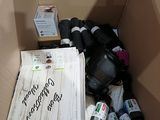 a cardboard box filled with books and other items