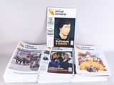 a lot of magazines that are stacked on top of each other
