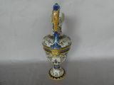 a blue and white vase with a bird on it
