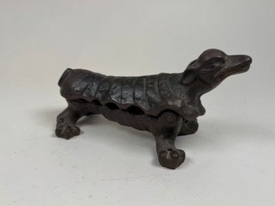 a small statue of a dog that is sitting on a table